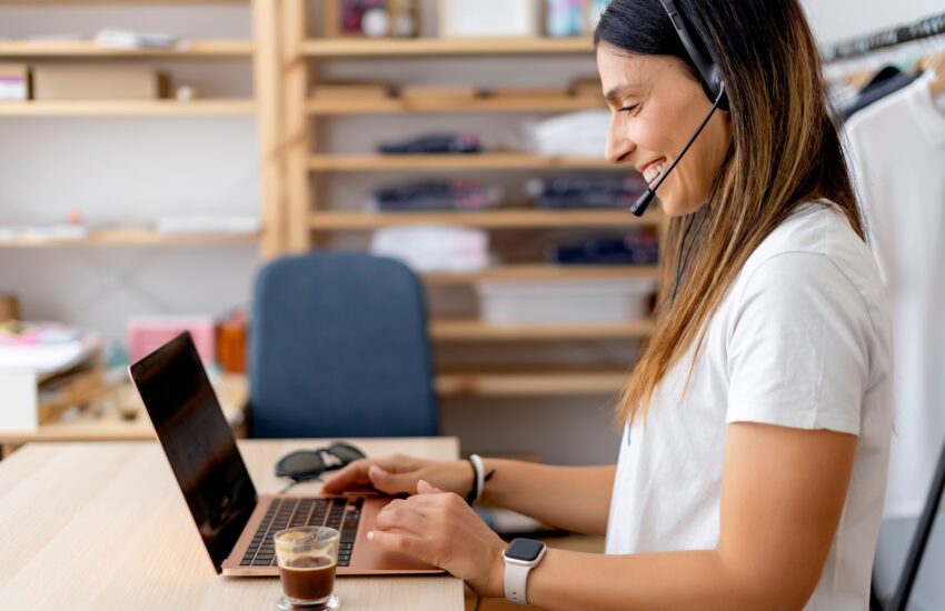 Woman teleworking at home with computer