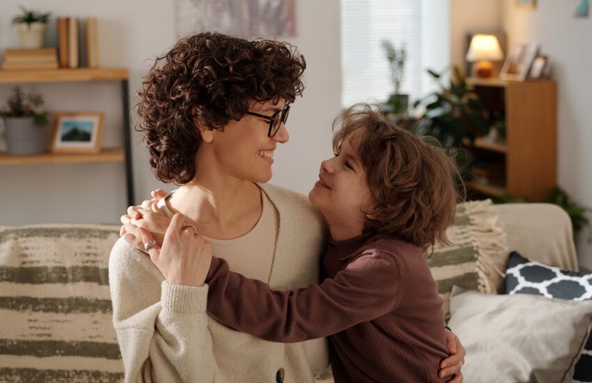 Mother and son embracing each other